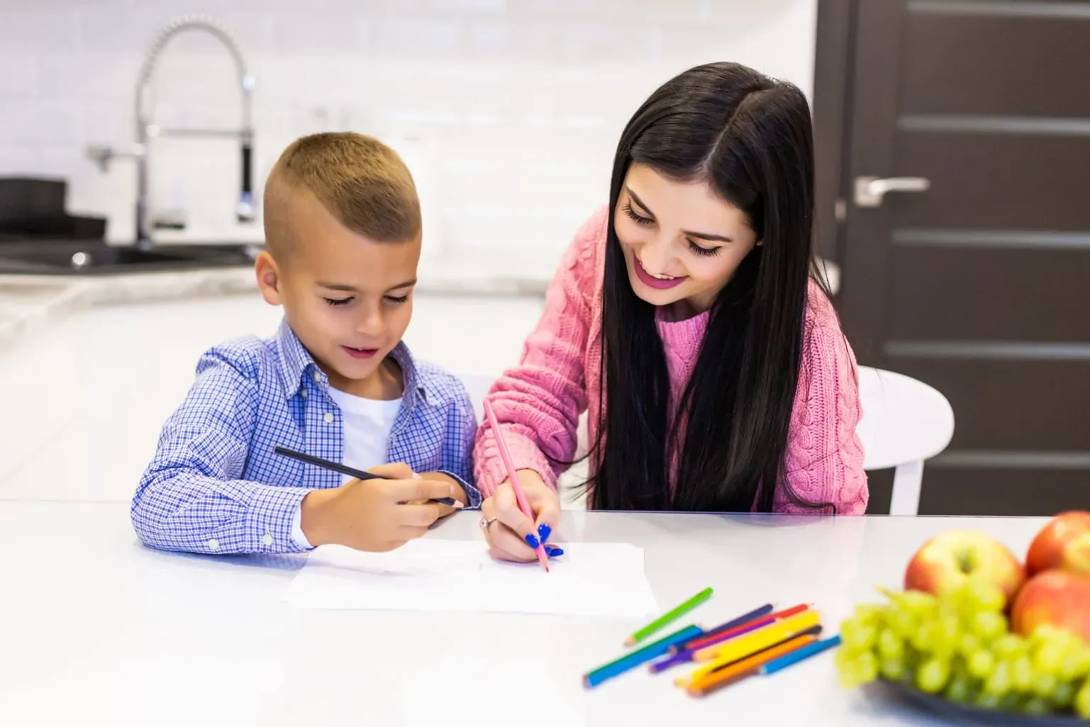 compressed_happy-mother-son-drawing-with-color-pencils-is-having-fun-home.webp
