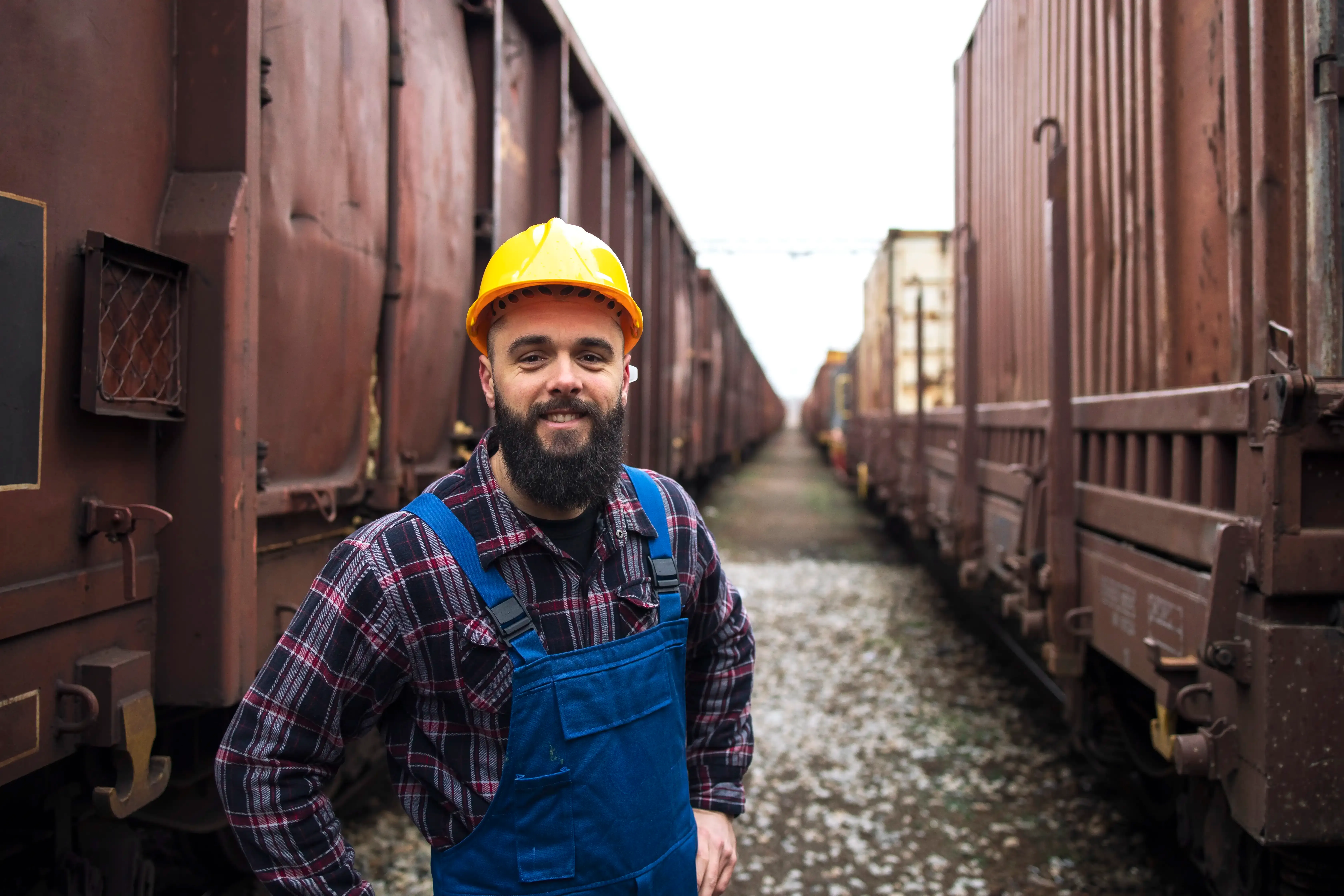 portrait-smiling-railroad-worker.webp